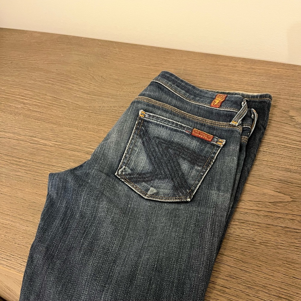 Seven for all man kind. Size 24 blue jeans. Flared